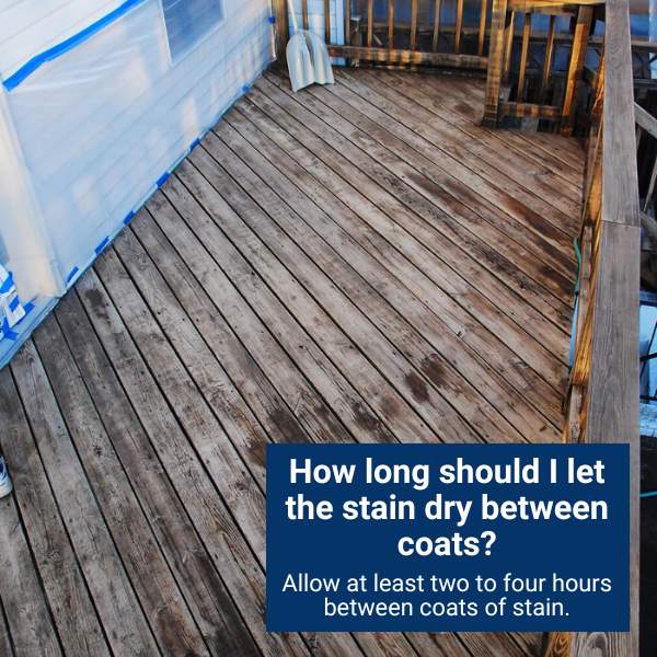 How long should I let the stain dry between coats?