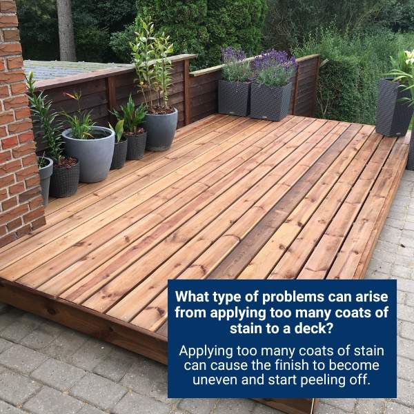 What type of problems can arise from applying too many coats of stain to a deck?